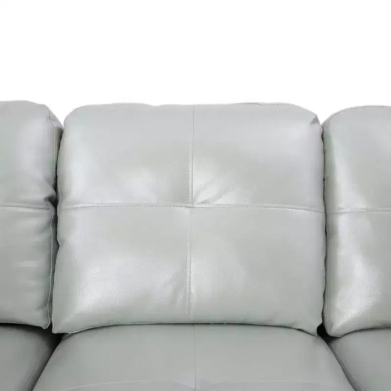 Sofá Seccional de Piel Sintética Gris en Configuración en L, Tapicería Capitoné, Otomana de Almacenamiento Versátil, Solución Contemporánea para Espacios de Vida